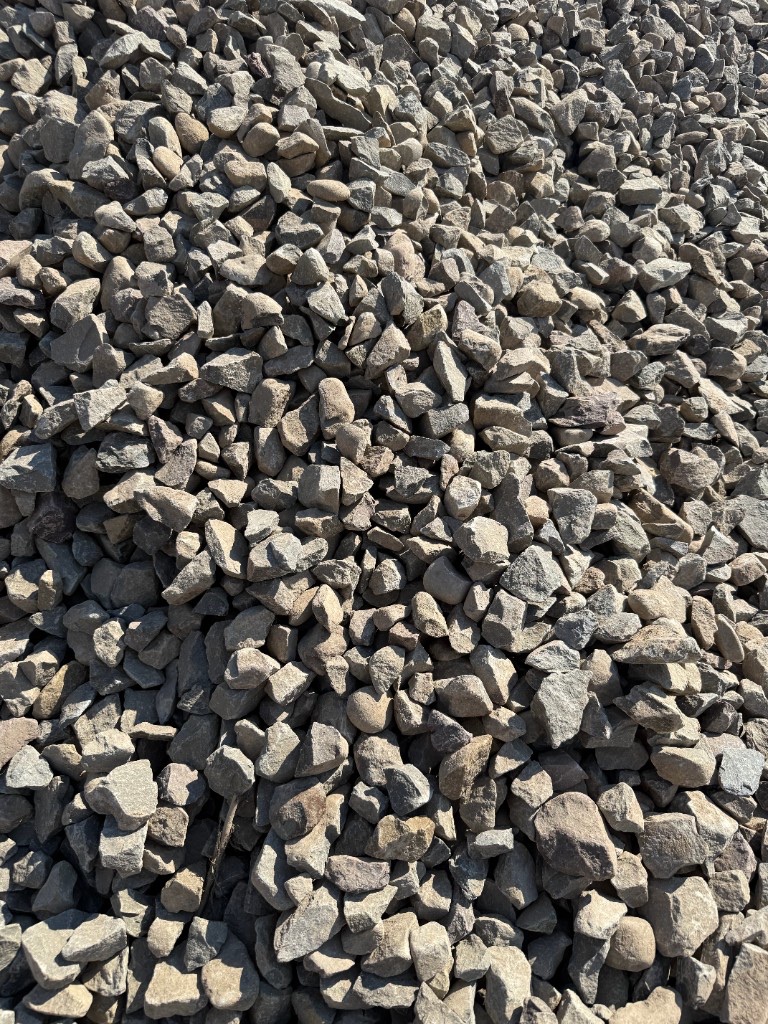 Number 3 crushed stone: angular gray and tan gravel.